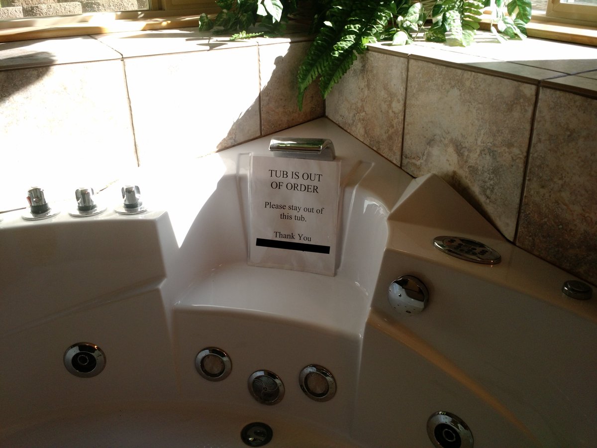 SPOILER ALERT: I got in the tub to take a picture of the sign telling me to stay out of the tub.