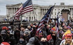 So... this flag, looks like the Betsy Ross, but has 3 in Roman numerals inside the star circle, that after some research appears to belong to the Three Percenters an anti-government, libertarian militia advocating gun rights. There appears to be writing on these...?  #CapitolFlags