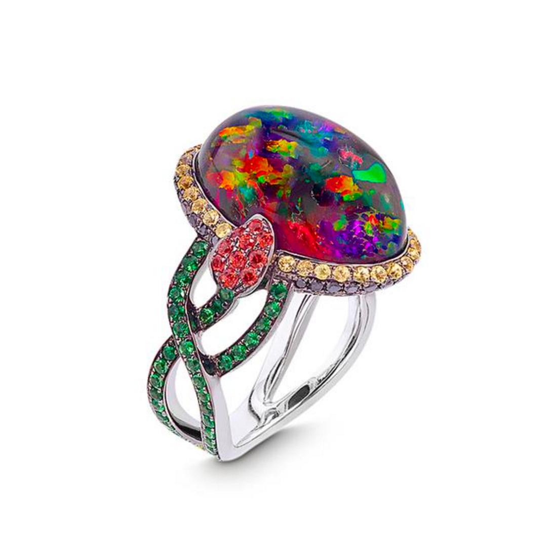 Okay! Emeralds! Gorgeous opal ring, with either a bi-color snake or a tulip (I think tulip) for the ring. Nice. (Jetter)
