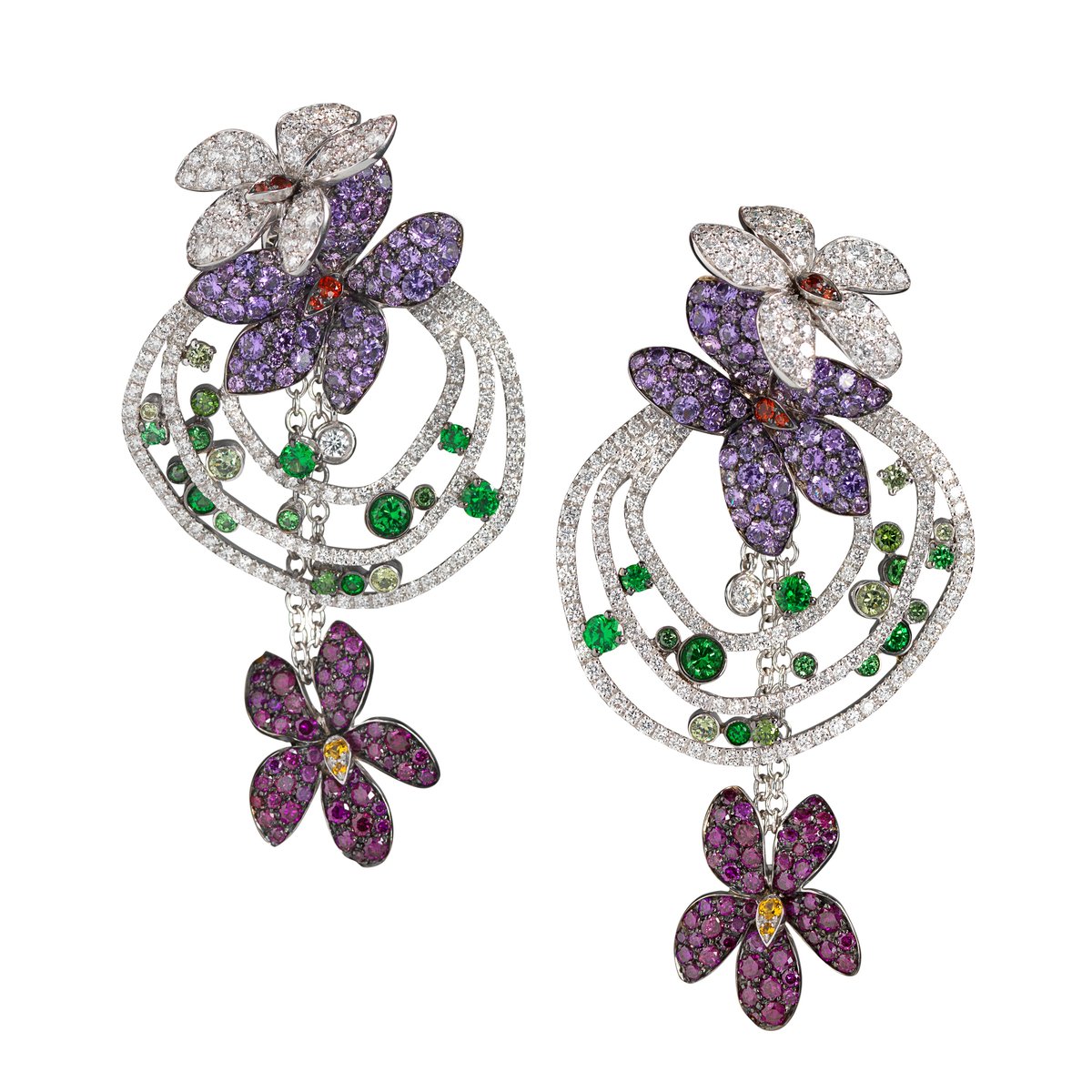 I love these. Floral earrings. Done a billion times, right? But they make them cartoony, throw in a swirl and emeralds to read as leaves, and boom. New again. (Palmiero)