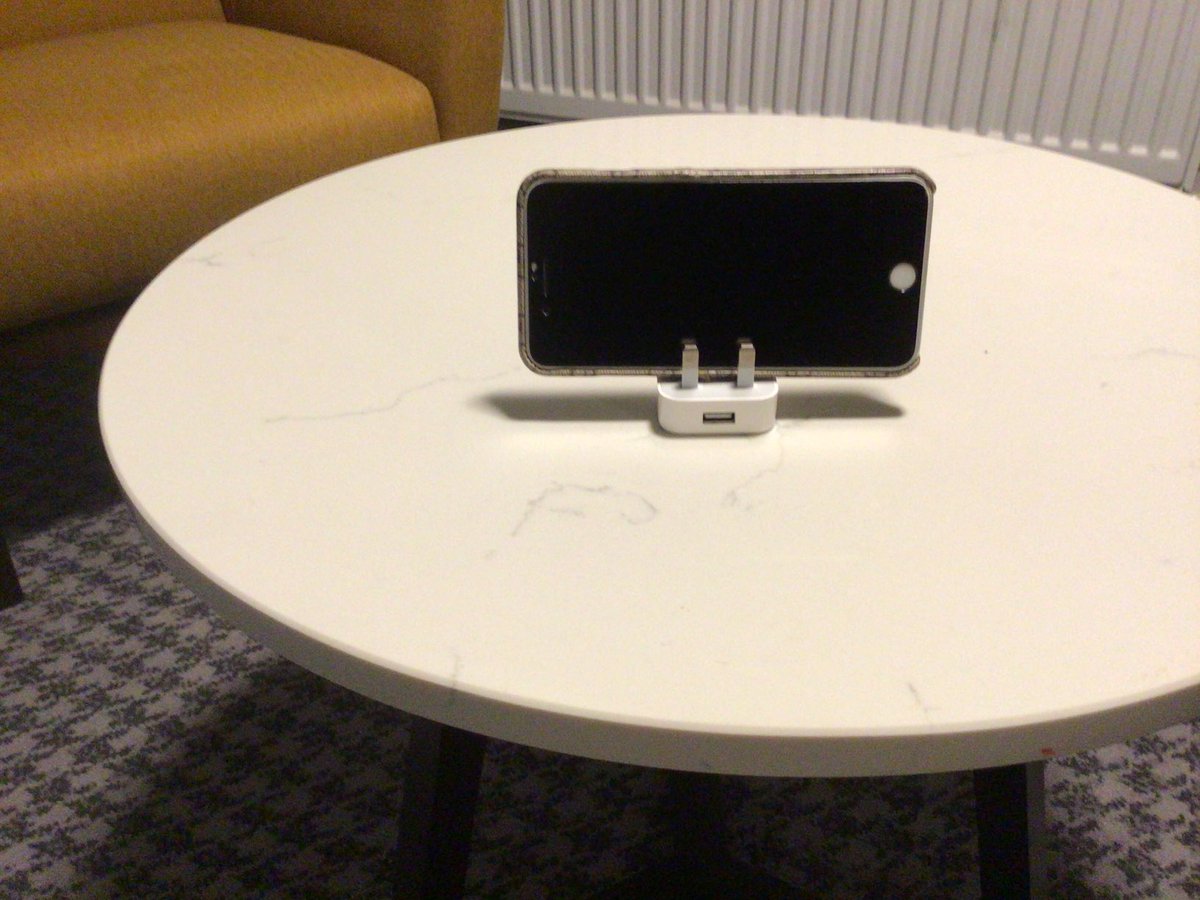 FrankMSinclair's tweet photo. Are you fed up of leaning your phone up against something to be hands free and it falling over? Let me share one of my secrets, did you know your iPhone charger plug doubles up as a stand?#Knowledgeispower #hotelboredom #whoknew 🤩🗣 https://t.co/bbNJnKq79r