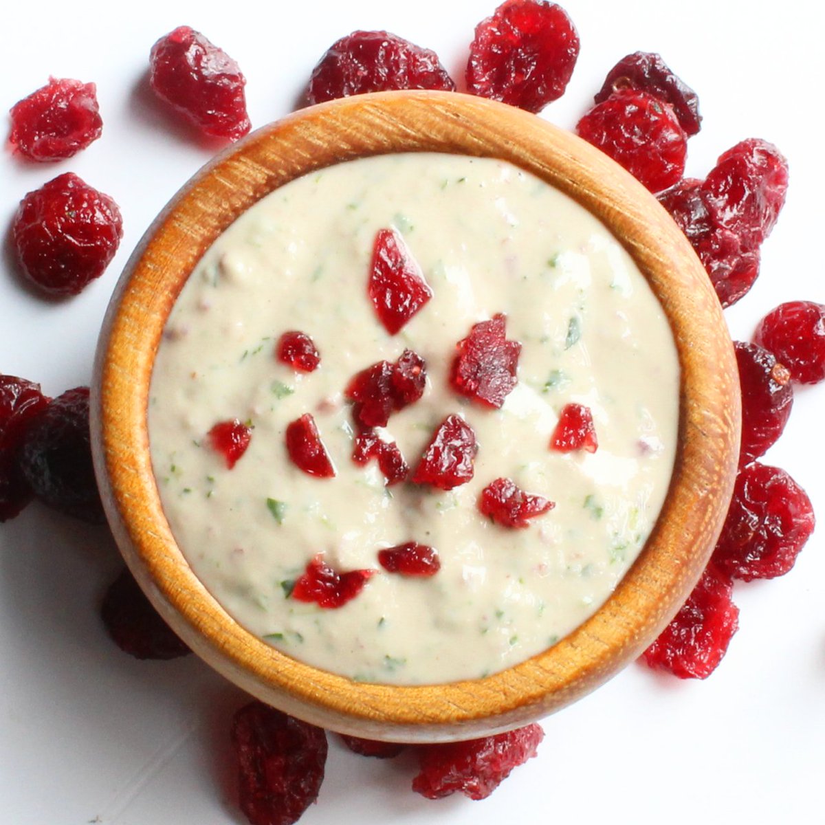 tini bini bobini, introducing cranberry tahini! the tangy sweet tartness of cranberry meets the exploding flavors of sesame seed, fresh parsley, lime and garlic creating the perfect party for your taste buds. add this to your #mezehmix and the flavor will be *chefs kiss*