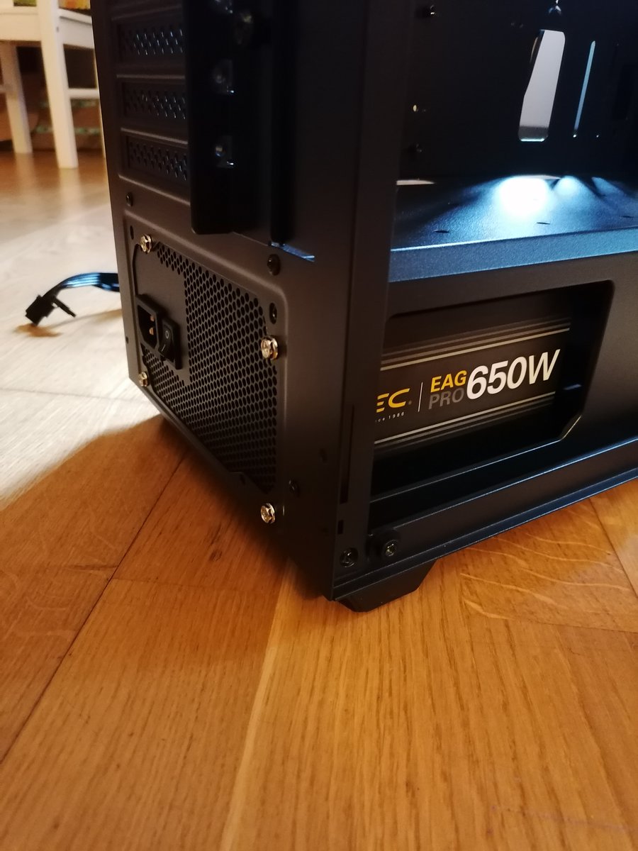 Step 3: Installing Power Supply Unit (PSU). I turned the fan downside because there was air exit grid on the case floor.