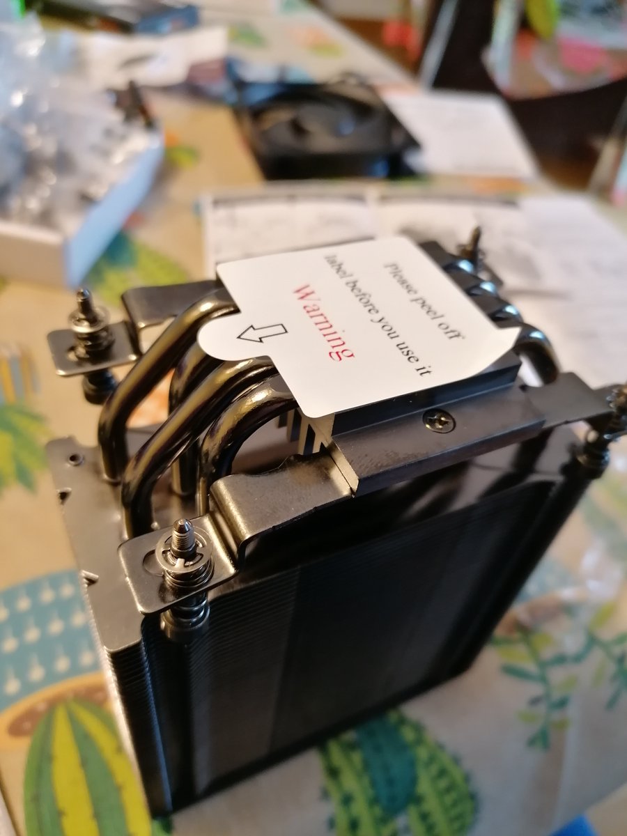 Step 7: Assemble CPU cooler, apply thermal paste to the CPU and screw everything tight. Don't forget to connect the fan connector to the motherboard.