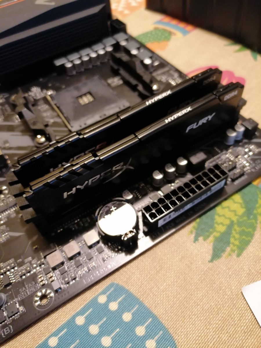 Step 4: Take the motherboard. Install DIMM memory slots. I installed them into the recommended slots to take advantage of the double channel to CPU.