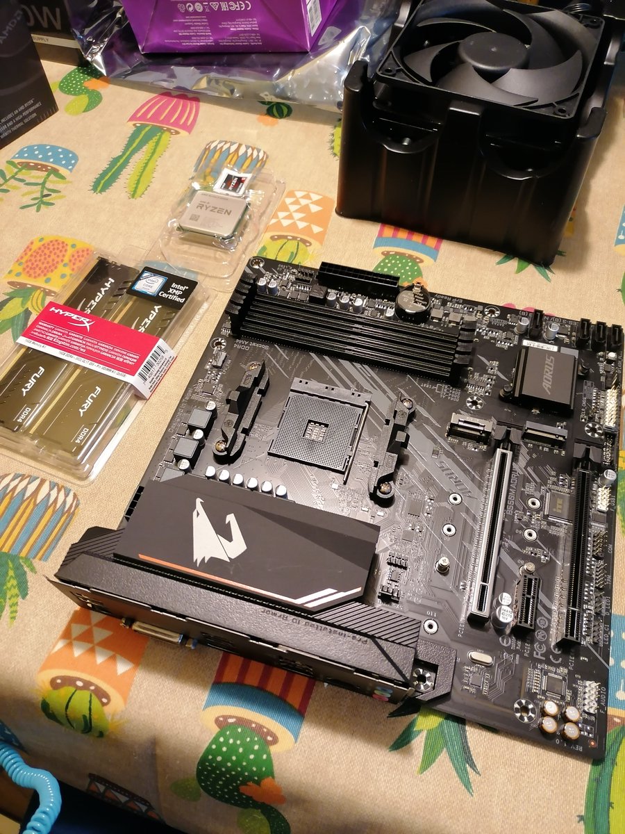 Step 4: Take the motherboard. Install DIMM memory slots. I installed them into the recommended slots to take advantage of the double channel to CPU.