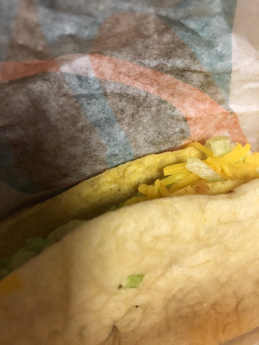 TaylorHanberry's tweet photo. Thanks @tacobell for my cheesy Gordita crunch with a side of #covid from your North Charleston location. Such poor service! Better take a look before someone else gets this disgusting hair in their food! It’s not mine either. 

#sogross #hairinmyfood #COVID19 #tacobell #infected https://t.co/uyBzMT1x4R