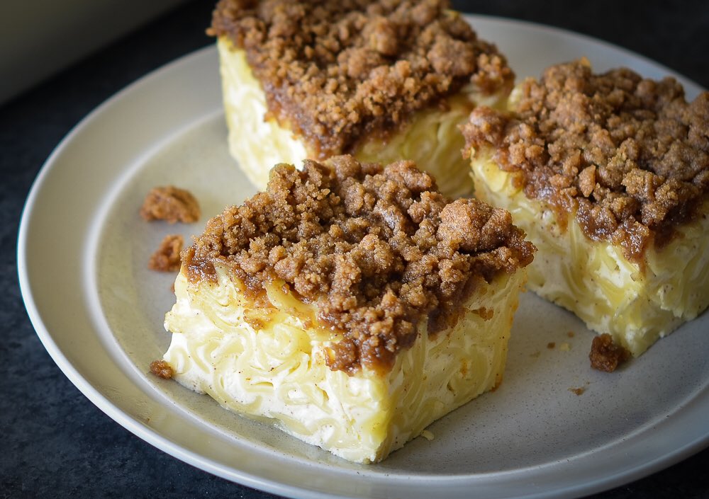 sweet lokshen kugel— layered pasta dish with cream cheese and raisin filling topped with sweetened crushed cereal