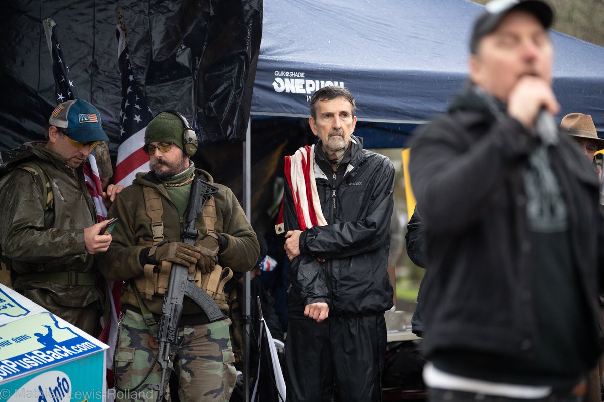 (4) Speeches are given while armed men watch over.