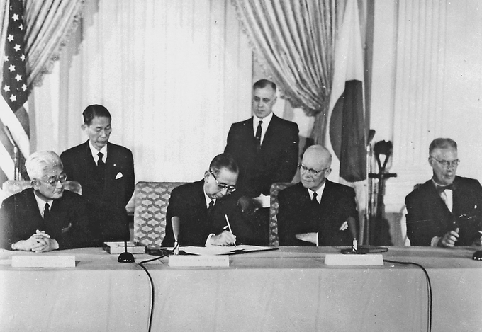 At issue was arch-conservative prime minister Kishi Nobusuke ramming through an unpopular renewal of the US-Japan Security Treaty, which is the treaty that to this day allows US troops to be based on Japanese soil.(pictured: Kishi; Kishi and Eisenhower sign the treaty in 1960)