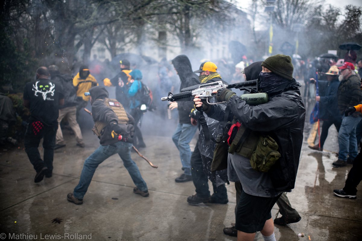 (9) Chaos erupts as smoke, fireworks and projectiles fly through the air.