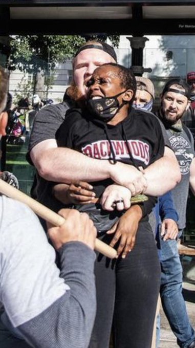Can we find out who this guy is? He assaulted this woman grabbing her allowing his fellow trumpers to