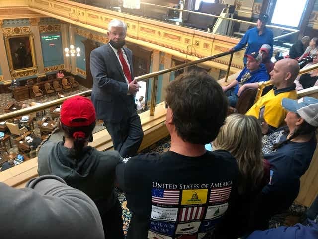 Inside the capitol, Republican  @SenMikeShirkey welcomed the armed protesters like they were his old hunting buddies. 4/8
