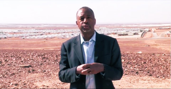 Ben Carson posing in solidarity with the rest of the Trump cabinet.