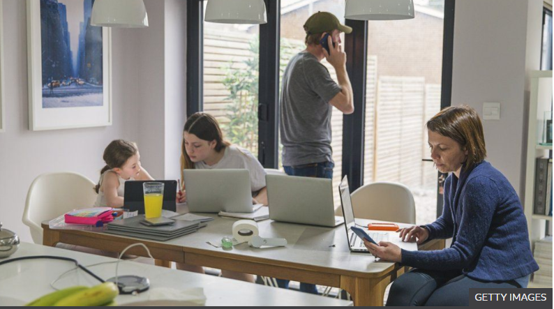 Oates27's tweet photo. I love the BBC stock photos they roll out when they are talking about home schooling.  A total of 6 devices in this image.  It looks calm, there's even a nice glass of juice on the table. Tempted to recreate my own (more realistic) version. https://t.co/Smwwj28KXr