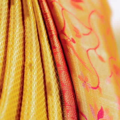 These sarees are woven from pure mulberry silk. While silk belongs to South India, the pure gold and silver zari comes from Gujarat. The silk thread that is used to weave the saree is dipped in rice water and sun-dried before use. It is then interlocked with a thin silver wire.