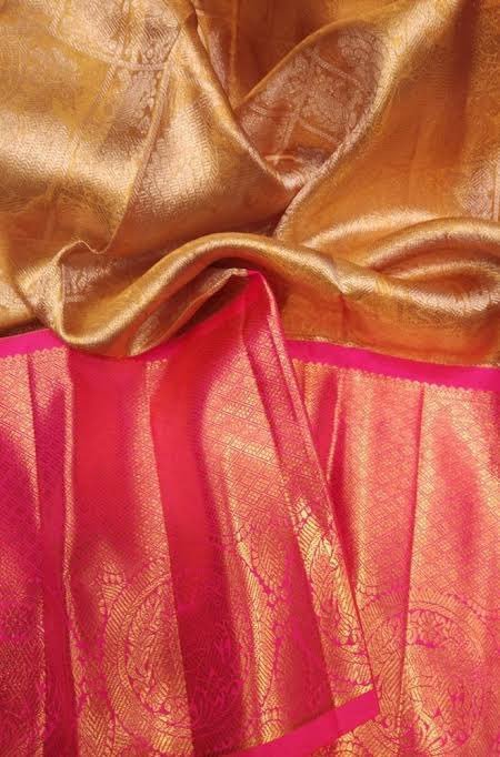 One of the most foolproof ways to tell the difference between an original and fake Kanchipuram silk saree is to pick a few loose threads from the saree, burn them, pick remaining ash and smell it. You’ll be met with a smell similar to that of burnt leather or hair. Cr:internet