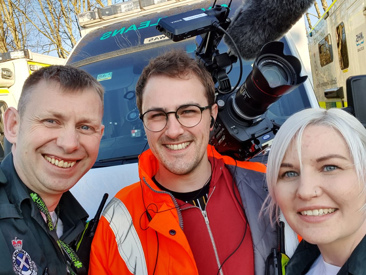 Great story on Lee Myers and Nadine Greenfield, who feature in the latest series of #ParamedicsonScene.

Lee said: "It's an honour to represent the job we love."

Read more at bit.ly/3nl2ckk

The pair are pictured with Fraser McArthur of <a href="/FirecrestFilms/">Firecrest Films</a> pre Covid-19