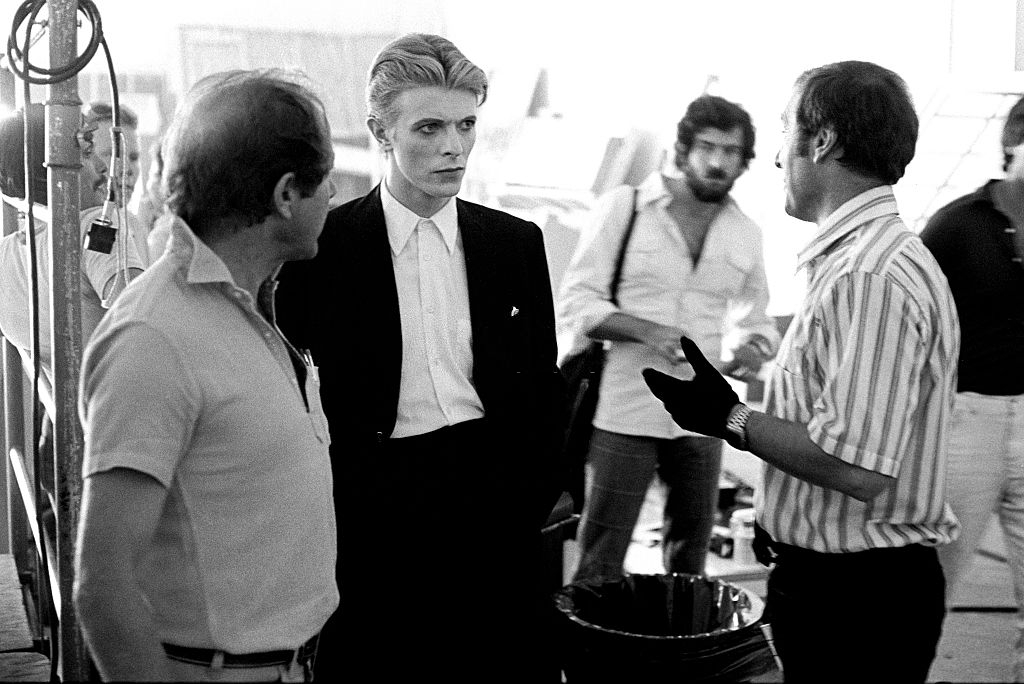 David Bowie with Nicolas Roeg and crew during the filming of The Man Who Fell to Earth (1976). Photos: Steve Schapiro