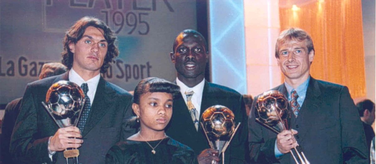 FIFAcom's tweet photo. ⏪ 25 years ago @GeorgeWeahOff became the 1st and to date only African to win FIFA's top men's individual award. We recall the then @acmilan striker beating Paolo Maldini and Jurgen Klinsmann to the prize and his incredible career 🥇

👉 https://t.co/KYhOnrUaEN https://t.co/E3UUS2bLUr