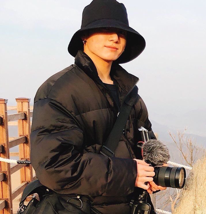 a bucket hat, a camera, a puffy jacket??? this outfit?? Mom he's perfect 