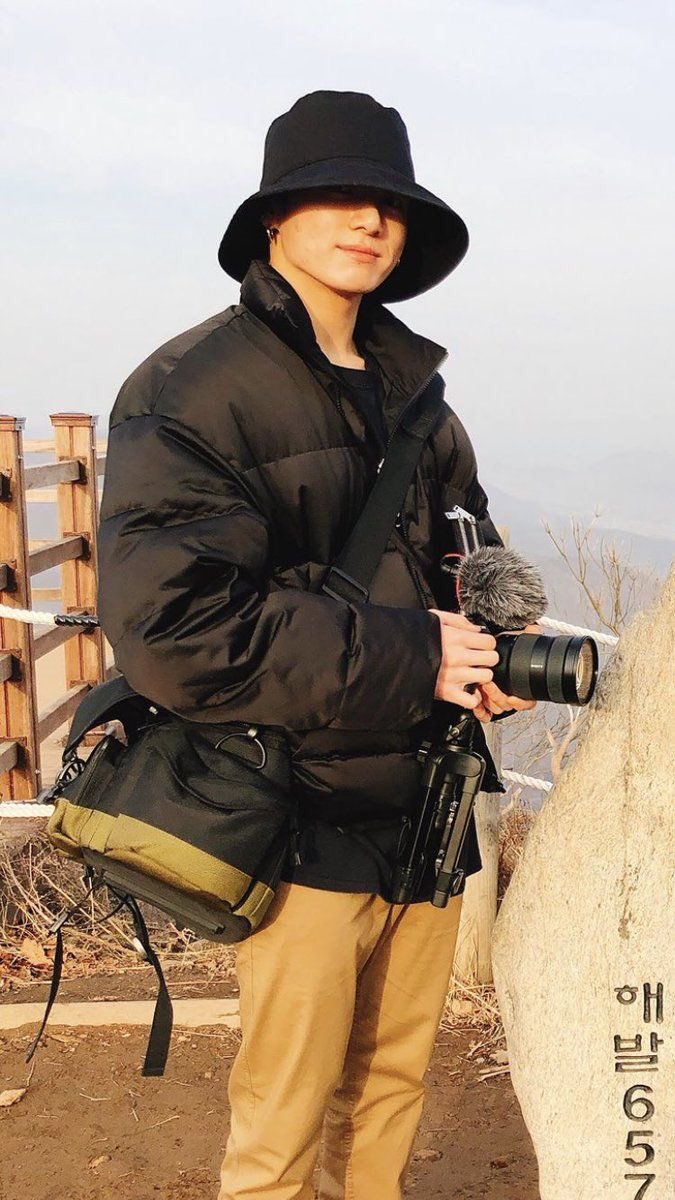 a bucket hat, a camera, a puffy jacket??? this outfit?? Mom he's perfect 
