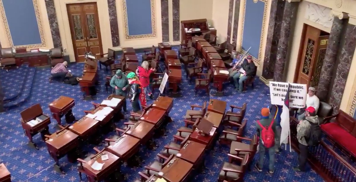 2:57PM EST: Protesters enter the Senate floor, they take a look around and pose for photos. "Where's Pence, show yourself!" yells the now-infamous Qanon conspiracy theorist with the fur costume and horns. ( Photo from  @frankthorp &  @stevennelson10)