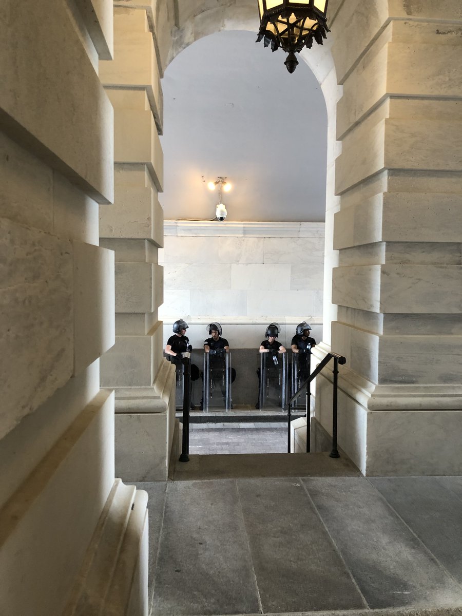 Even more officers in riot gear - and even more riot gear - out of plain sight.