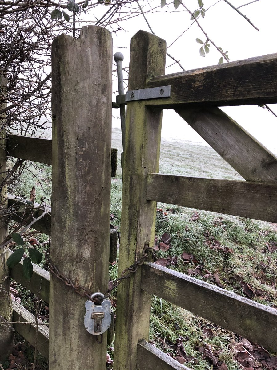 Shortcut across field to chained gate - but room to crawl underneath through frozen mud, having hidden in fog from 2 men and a vehicle who were burning cleared hedge stuff