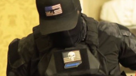 But I must underscore that people consider the intention behind the patches and symbols that were visible on the zip-tie guy's plate carrier and consider whether or not they are part of an effort to obfuscate where the perpetrator is actually from.