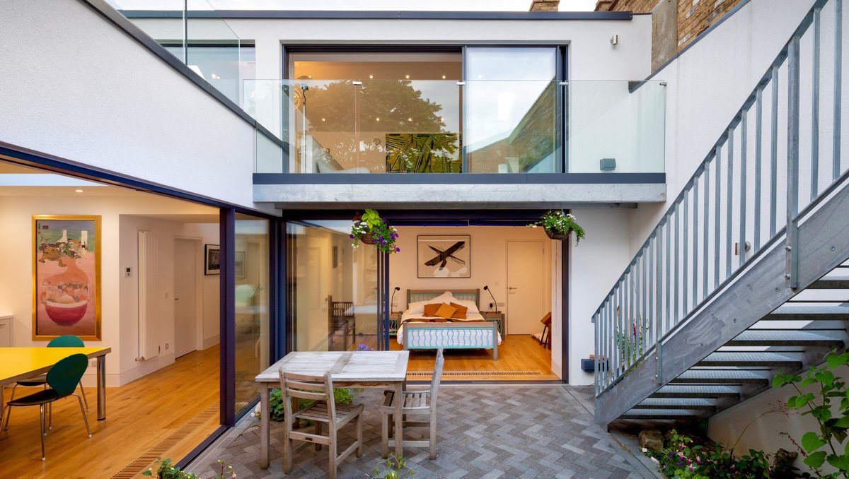 ✨Never a shortage of natural light in this eye-catching two-story! It's bright, airy &amp; gorgeous ✨
⁠
Some houses stand out as different. Like this contemporary new build we did in #Greenwich. #Bedroom downstairs? Why not! 🤩⁠

#londonarchitects #builder #landscape #architect