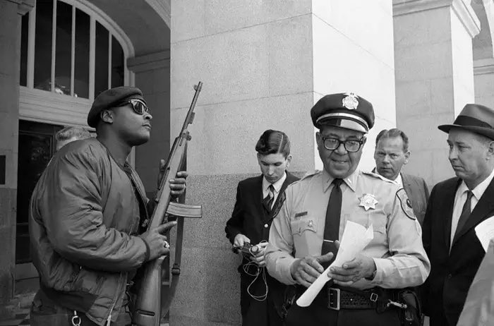 In California during the 1960s, it was perfectly normal to open carry. That’s why you see so many photos of the Black Panthers with big rifles on their shoulders. The initial purpose of the party was to patrol the Oakland Police using gun laws and reading California law books.