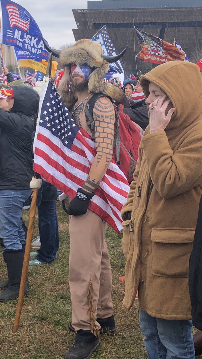 Next, in the same picture, is buffalo man Jake Angeli. People have a lot of ways to “prove” he’s antifa, and all are bogus. They’ll point out his tattoos, saying that one of them is the “boylover” symbol.