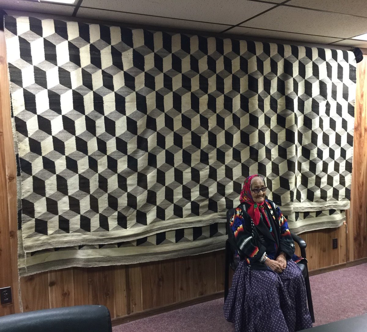 jfkeeler's tweet photo. Margaret Dalton born in 1923 of Ft. Defiance, Arizona completed this rug back in the 1950s. The rug is folded over 4 times in order to hang properly on the wall. It is made of natural dye and woven in the form of a geometric design. The rug measures over 150 X 50 ft. #DinéBeauty https://t.co/wLfE6WQxRK