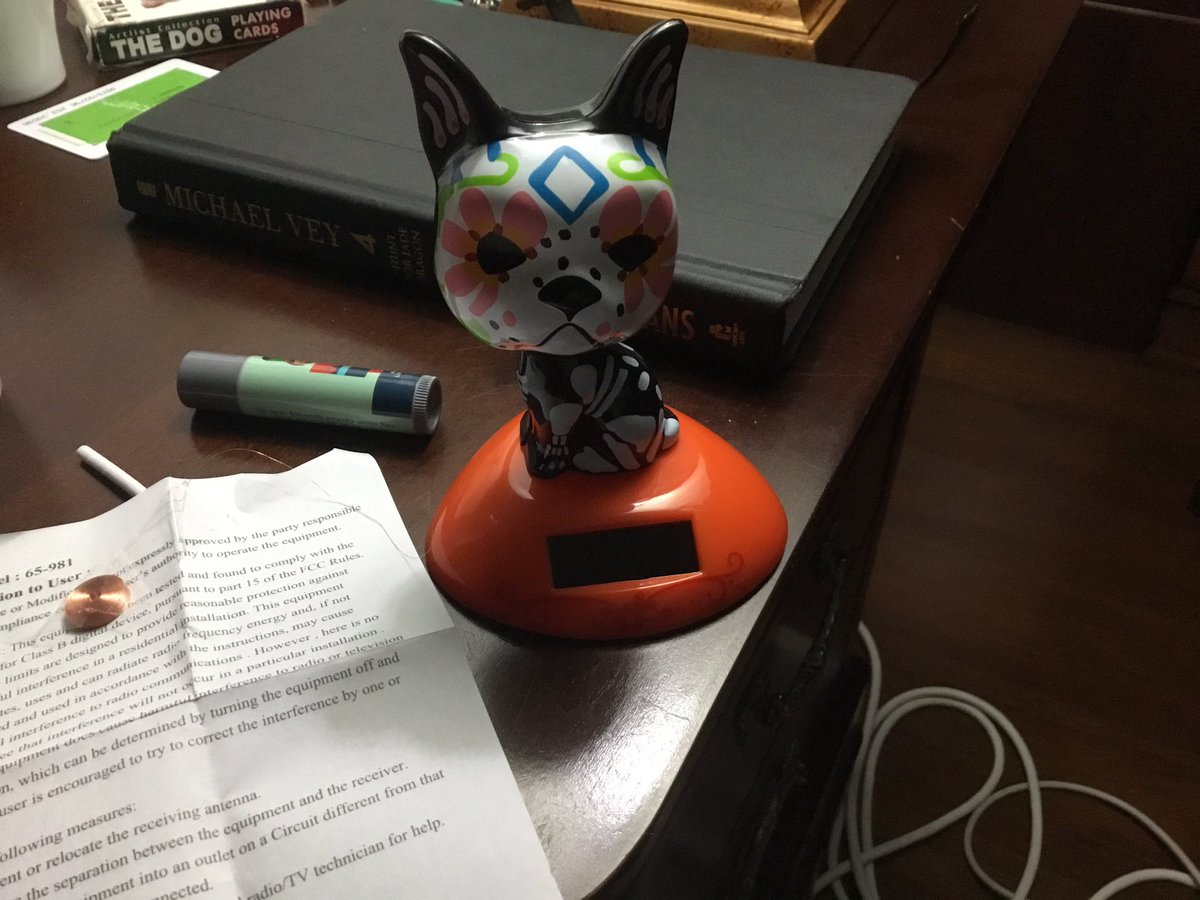 ShylowYT's tweet photo. Somebody help.  What is this?  It has this copper wire and weird note attached.  It’s just a solar-powered bobble head, right? https://t.co/31iMISBL5y