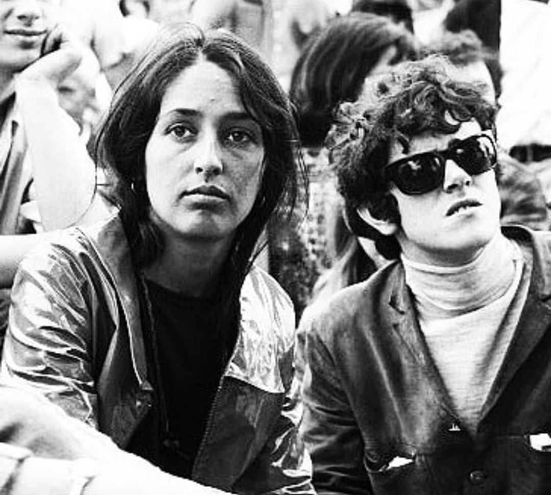 Joan Baez performs an anti-Vietnam War demonstration in London's Trafalgar Square on May 29, 1965 with Scottish folk singer Donovan.