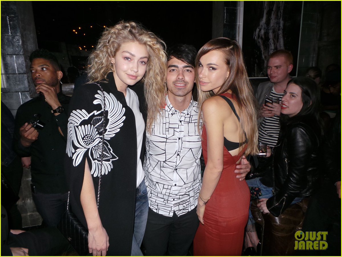 Two other pictures of Joe in the middle of the two best friends he dated, Blanda Eggenschwiler and Gigi Hadid.
