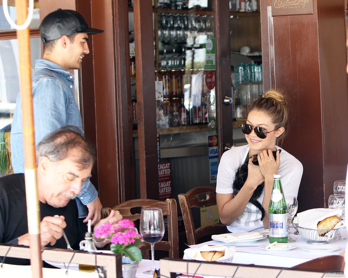May/June 2015: Paparazzi caught Joe and Gigi Hadid hugging and kissing.
