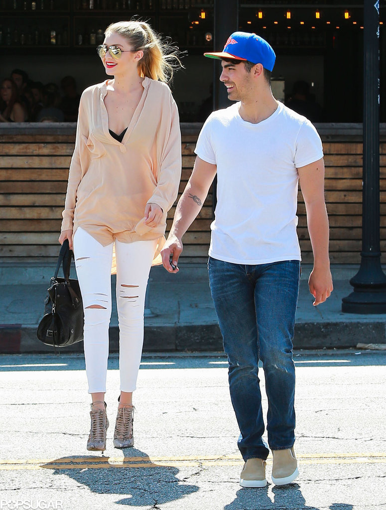 May/June 2015: Paparazzi caught Joe and Gigi Hadid hugging and kissing.