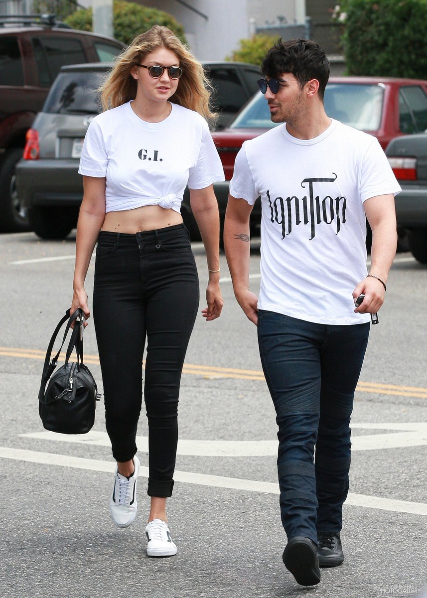 Joe and Gigi dancing, hugging and kissing each other.