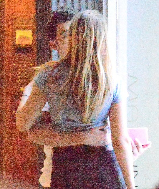 Joe and Gigi dancing, hugging and kissing each other.