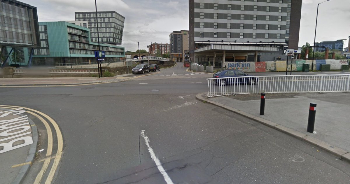 Flared junction for roads has been shrunk into a small roundabout where one arm now leads to a bike track (before/after). Much more efficient use of public space.Access for motor vehicles retained to all properties (note no bollard in bike track here, to permit this)