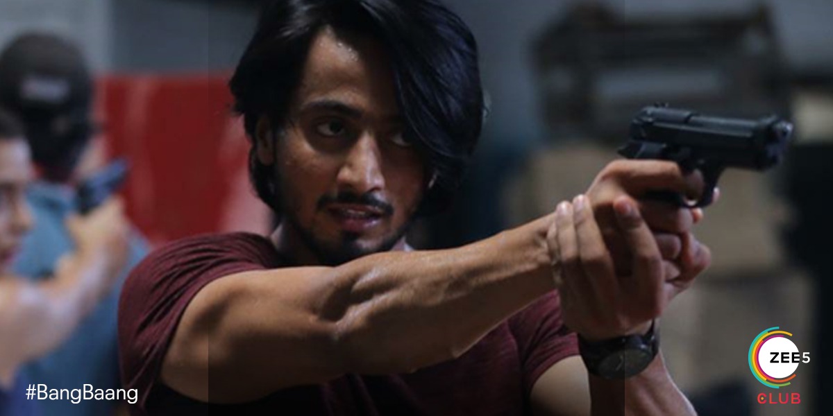 Free5onZee5's tweet photo. Goli ek, nishane anek. Kya Raghu ka nishana hoga perfect ya hoga miss?  Stay tuned to find out what happens next! #BangBaang, Premieres 25th January on #ZEE5Club. #HateMates https://t.co/IUD37tTvN7