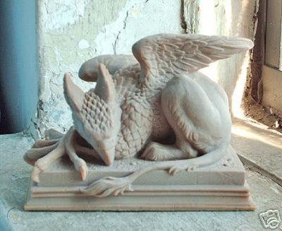 The Guelph Gryphon has emulated these changes EXACTLY, down to which claws hang off which side of the podium and the musculature in the back leg. The only differences are the absence of extra “fluff” on the tail, and Guelph’s gryphon has its eyes open instead of closed.