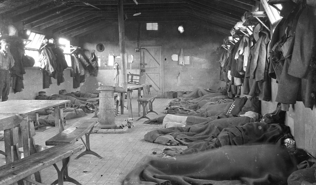 What I found fascinating were the pictures taken inside the huts. The detail & clarity was superb. When looking at them recently, I saw what appeared to be a regimental service number written on a kit bag, visible on the right hand side of the photograph below... 3/11