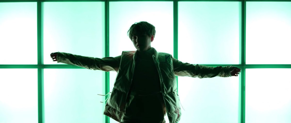 this is used in shadow when the instances when only a silhouette of yoongi is there. also, when the shots are underexposed (has too little light) or spotlighting is used. these techniques hide a character; hiding their identity,