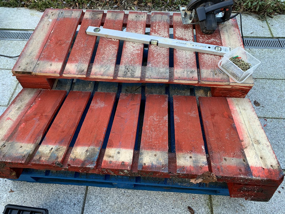 We cut right across the pallet with a circular saw to one one side of the middle back board