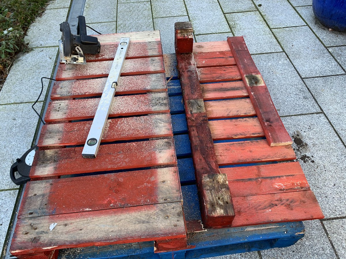 We cut right across the pallet with a circular saw to one one side of the middle back board