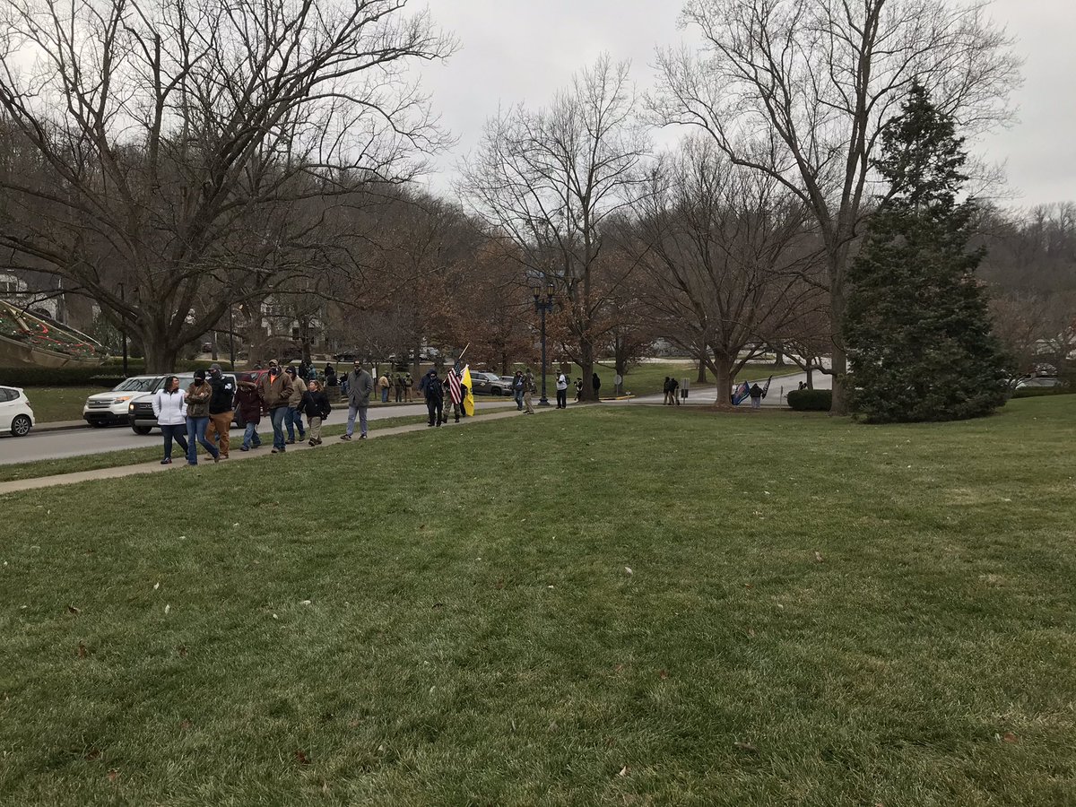 Crowd has largely left. About two dozen did a lap around the building