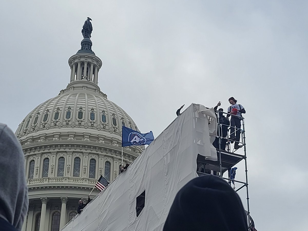 It was another surreal moment seeing folks climb the scaffolding with capitol dome in the back ground. I still can't process it all. Folks bring a giant American flag to drop from the top. 76/